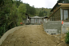 The driveway retaining wall has been formed and the drive is being filled.