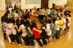 An active demonstration of paticca samupada. Each of the 50 teenagers seats is dependent on the knee of the one in front. The fun and laughter was dependent on a lack of timing. And we all fall down.