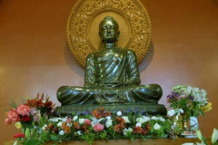 The main shrine at Bodhinyanarama festooned with flowers.