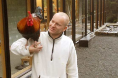 Anagarika Colin having a hearty precepts discussion with that rooster.