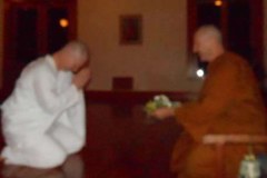 Colin offering a tray of flowers candles and incense to Ajahn Kusalo prior to requesting the Anagarika precepts.Sadhu! Sadhu! Sadhu!