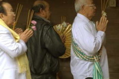 Venerable Elders circumambulating the main shrine hall.