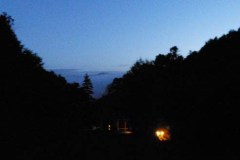 Looking toward the lower house on the way to morning puja. Stokes Valley lies in the distance.