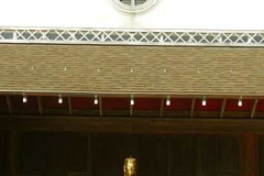 A vertical line of auspicious symbols.