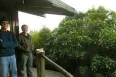 Richard and Colin get ready to open up the view from the topmost kuti.