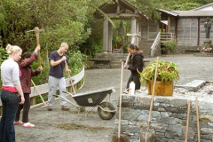 The road crew breaking rocks in preparation for the car park asphalt edging.