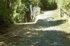 The track just below the upper house is now a gentle rise and downward slope.
