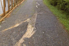 Heavy rain carved large ruts in the driveway and car park. All going well this will be sealed next month.