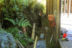 Cameron preparing the foundations for the dana table store. Tidiness is next to the fire hose.