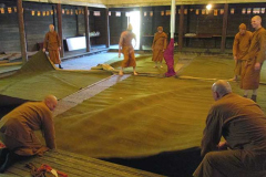 The day before – with the marquee up the cloister is dry and the carpets go down.
