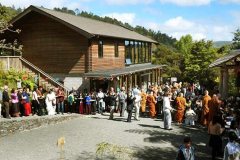 Under a clear and sunny sky the sangha goes pindapat.