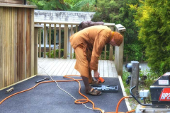 Ajahn Ariyasilo finishing off the top end of the fence alongside the kitchen.