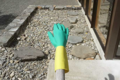 A drying kitchen glove gives a rocky benediction.