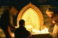Making offerings at the base of the stupa.