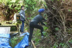 Natlie and Karmon Won give a #1 trim to the vegetation alongside the sala.