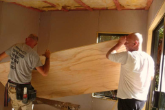 John and Chris maneuvering a ceiling panel into place. Only just enough room.