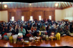 A four-shot pano of the Songkran gathering. 250 people happily packed into the hall. Lovely.