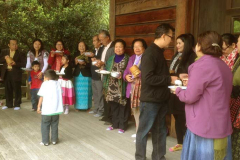 A small part of the group lined up on Sunday to offer rice to the Sangha.