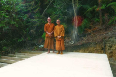 Ajahn Kusalo and venerable Kusalacitto testing the new floor of the lower kuti.