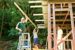The roof is almost on and the final rafter is fitted. Aunty Suan keeps an eye on progress.