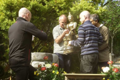 The buddha rupa is finally installed atop the beautiful stone plinth.