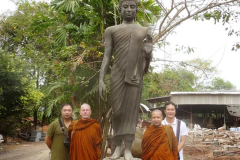 A 2.7m standing Buddha. Ajahn with venerable Rocano at the foundry.