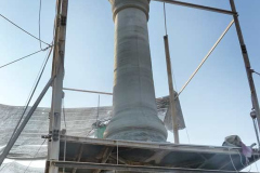 The pillar being erected on the site of Ajahn Chahs birth. Thats one single piece of stone.