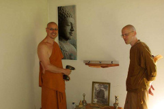 Shrine building in the Bhikkhu vihara. Ajahn Medhino leads the way.