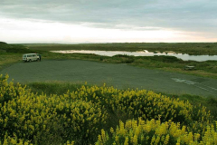 Tudong: our first night on the west coast. Estuary in foreground and sea over the dunes. This is just before the rain.