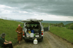 Tudong: stopping for a cup of tea to consider the next move. Manawapou beach in the distance.