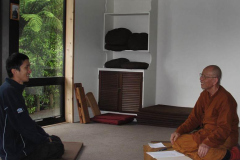 Venerable Kusalacitto meeting with a new guest to outline monastery life.