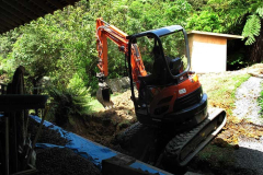 Terry in the digger widening the track which runs alongside the stream to by-pass the Chao Khun kuti. There has been quite a bit of landscaping around the new loo.