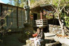 Sebastian preparing flags for our Kathina season celebration.
