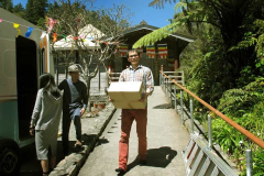 Lim carrying books. Young and May getting the coffee cart ready. New handrail - at right - ready and waiting.