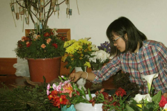 Tara carefully selecting flowers.