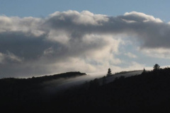 The early morning sky flows over the hill tops.