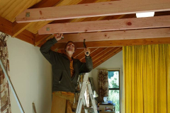 Ajahn Kusalo working on the new false ceiling in the Bhikkhu vihara common room.