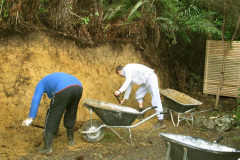Sebastian and Marcel trimming back the bank at the Chao Khun kuti to clear a straight line for the meditation walking path.