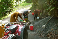 Vivienne and Claire help load the trailer to deliver gravel for the new hermitage track.