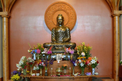 The sala shrine on new years day festooned with flowers.
