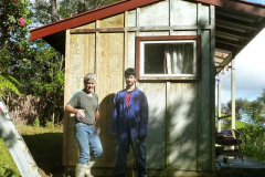 Alan and Alex getting ready to paint the remodeled #1 kuti. The recycled ply on the unkinked corner can be seen on the left. New glass in the windows.
