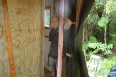 John about to wall up the new un-kinked back corner of the Ketu kuti.The extra space will add -- extra space.
