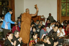 Ajahn Nantawat showers holy water blessings.