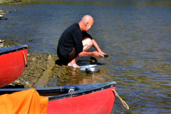 Ajahn Sucitto doing dishes. Note the band of duck tape on his foot. This was a common medical solution during the trip.