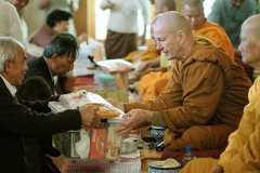 Gifts are offered to the Sangha.
