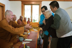 Khun Tho and her family have been long-term monastery supporters. Offering the forest-cloth is a fitting symbol of her dedication.