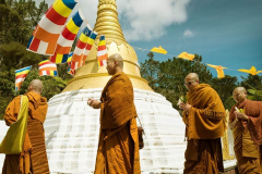 The Sangha processes around the stupa chanting blessings.