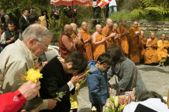 Offerings being made at the stupa. The monks chant rounds of Itipi so...