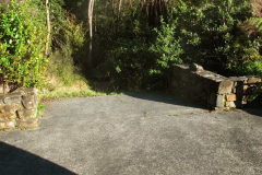The back side (West) of the stupa. An open hole that leaks into the bush.
