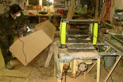 As much a photo of the new planer and sander in action as of Bruce putting finishing touches to the new book display.